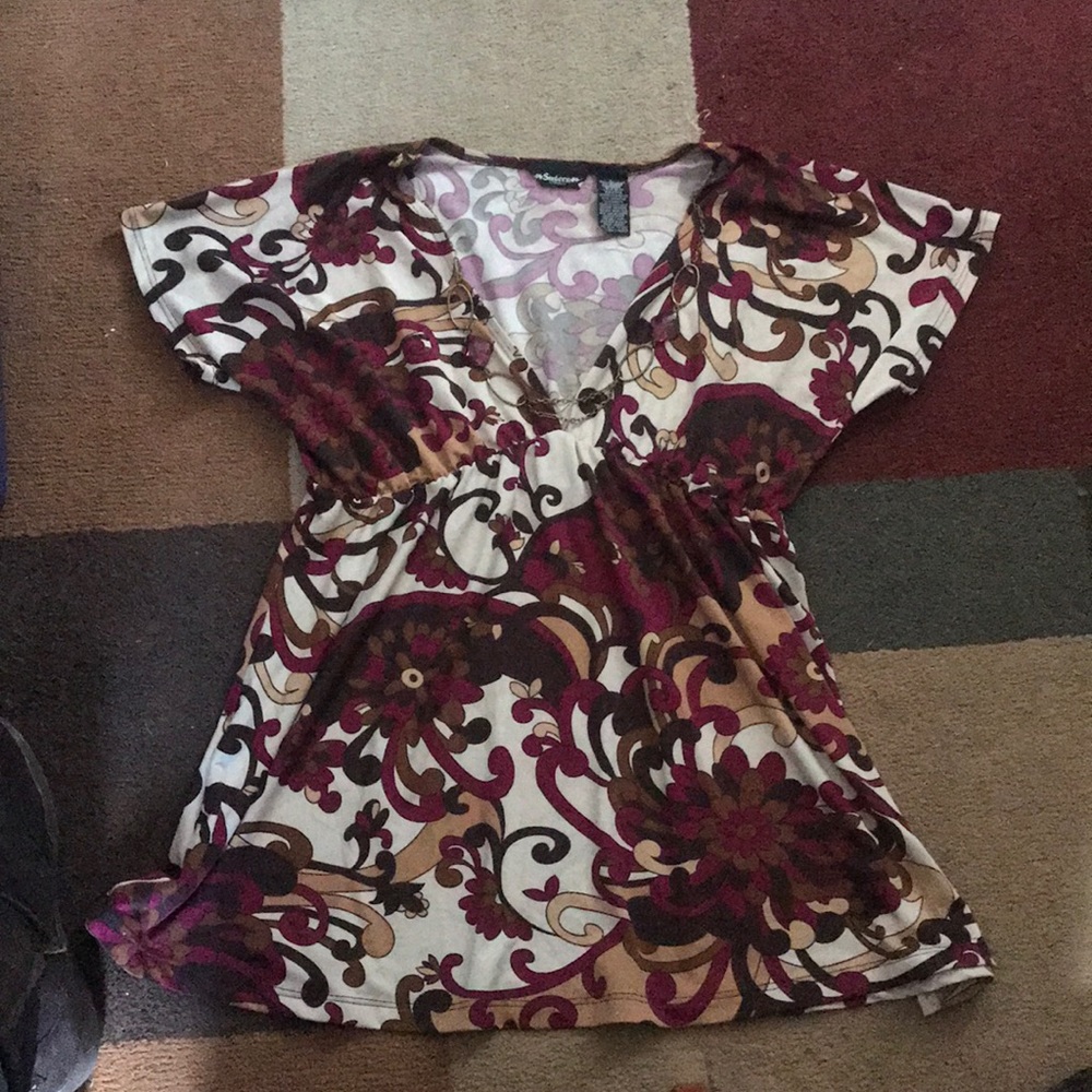 Women’s blouse with attached necklace